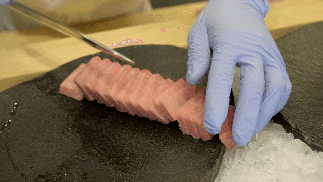 Tuna sashimi on black stone plate