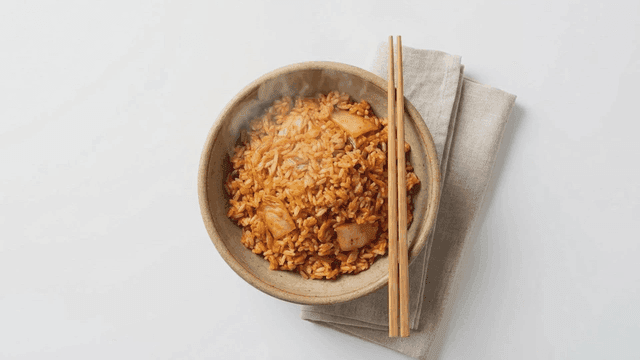 Steaming hot kimchi fried rice in bowl