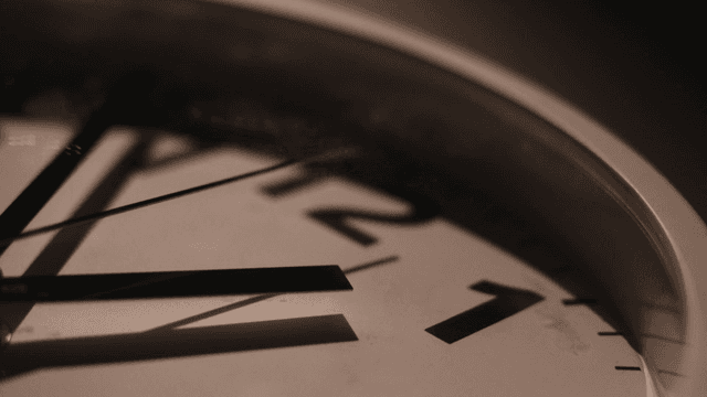 Close-up of a clock face showing time