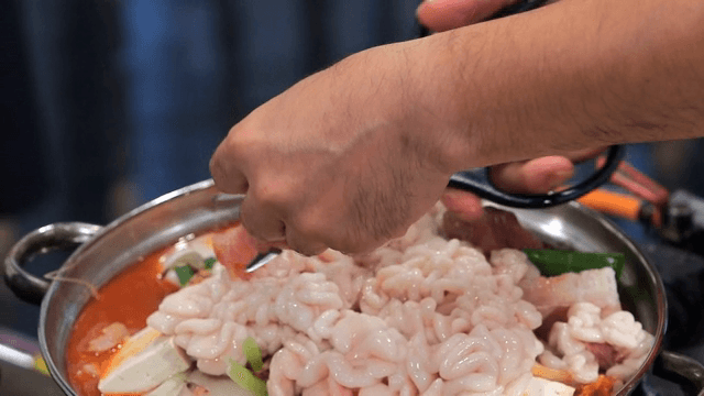 Putting cod roes in spicy fish stew