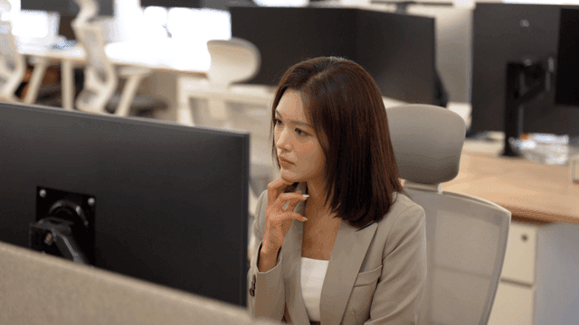 Female office worker concentrating on her computer screen