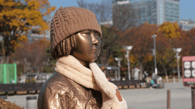 Statue of Girl in Autumn Park