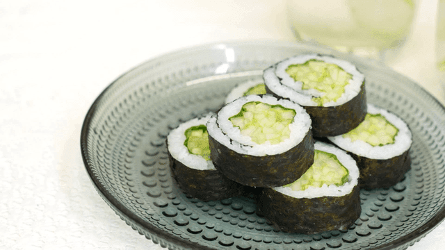 Cucumber gimbap on a glass plate