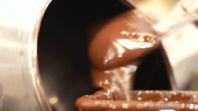Chocolate coating process in a machine