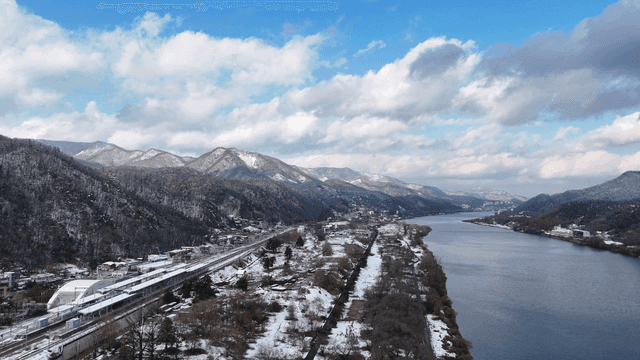 Snow-covered mountains and river landscape