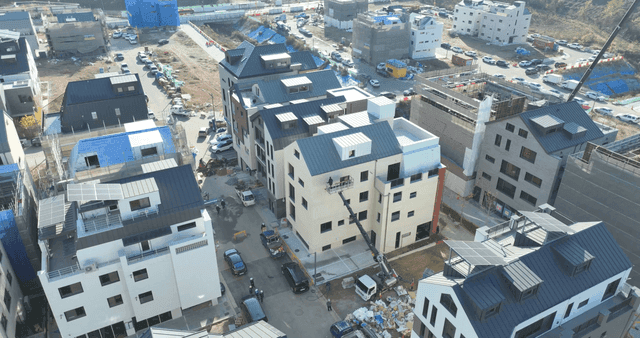 Construction site with ladder truck in residential area