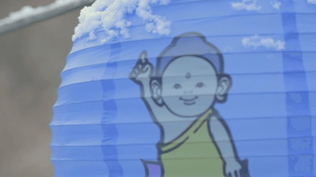 Snow-covered lantern with Buddha image