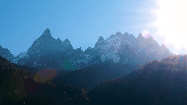 Sunlit mountain peaks with clear sky