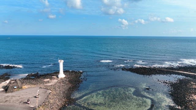 Coastal landscape with a lighthouse