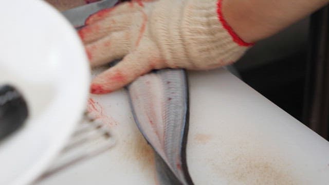 Eel being prepared in the kitchen