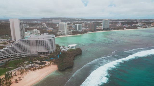 Coastal city with modern buildings and beach