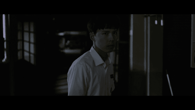 Angry student in dark hallway
