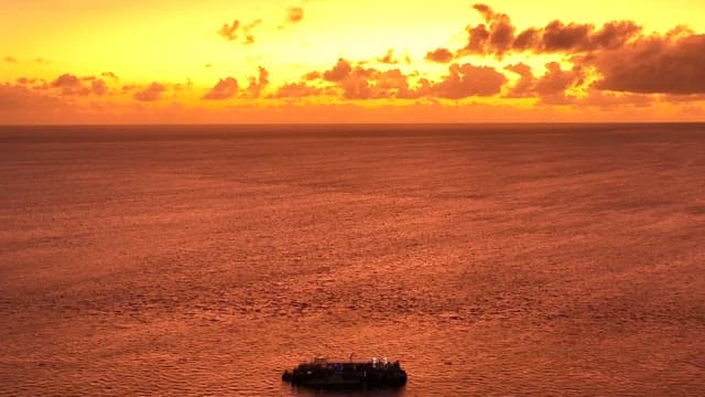 Tranquil Ocean Sunset with Clouds