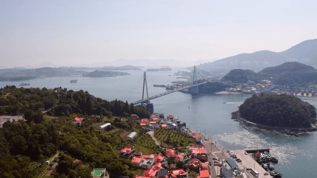 Scenic view of a coastal bridge and town