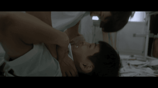 Students fighting and choking each other in classroom with scattered papers