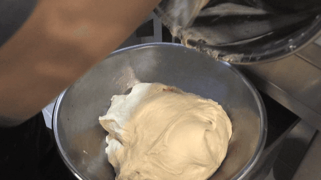 Sticky dough falling from mixing container