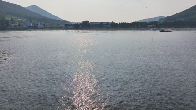 Serene beach with distant mountains