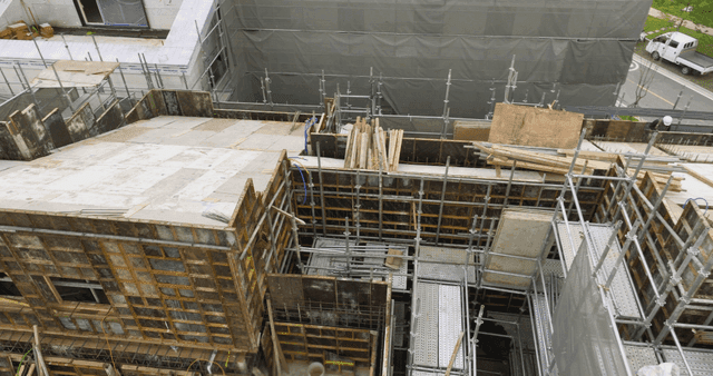 Construction site with workers and scaffolding