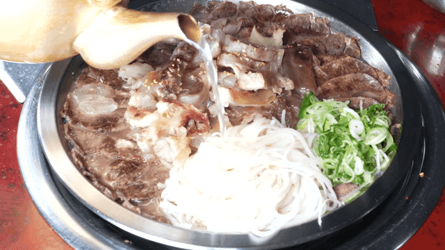 Boiled pork stew with noodles and vegetables