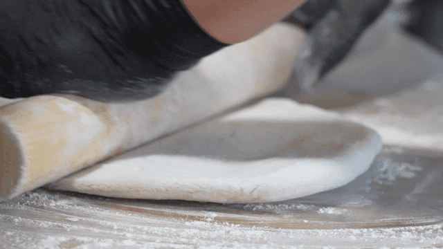 Rolling pin for rolling dough on floured surface