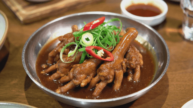 Spicy braised chicken feet in a bowl