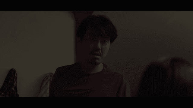 Man glaring at someone with a scary expression