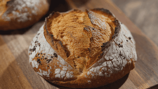 Freshly baked artisan bread on a wooden board