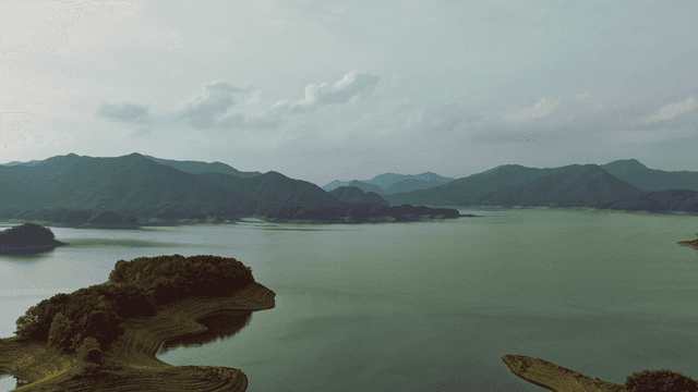 Tranquil lake surrounded by mountains