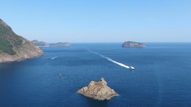 Coastal Seascape with Speeding Boat
