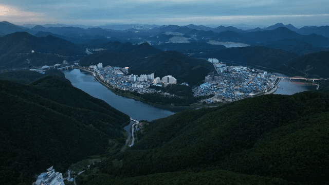 Scenic town nestled between lush green mountains