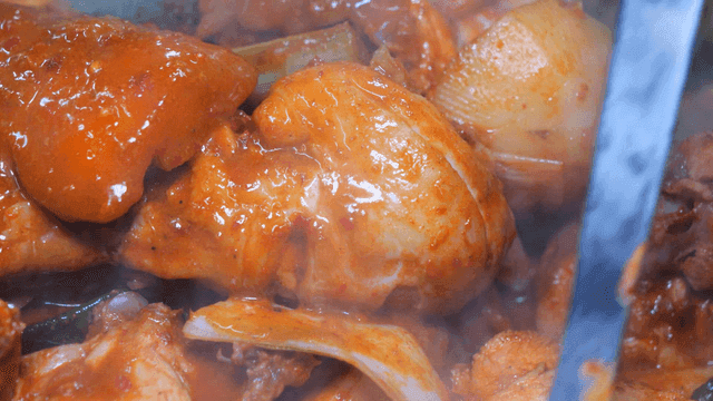 Sight of spicy chicken stew boiling