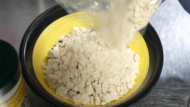 Zamid powder poured into yellow bowl