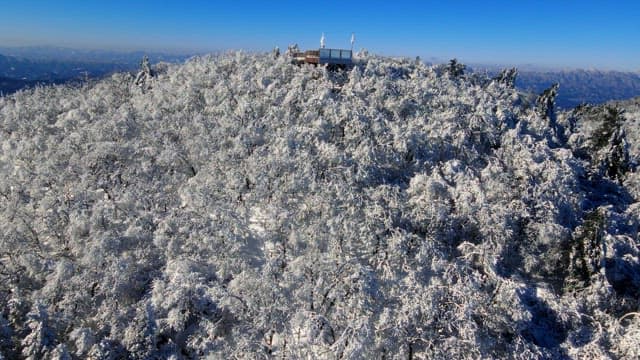 Observation deck on top of a white snow-covered mountain and magnificent view