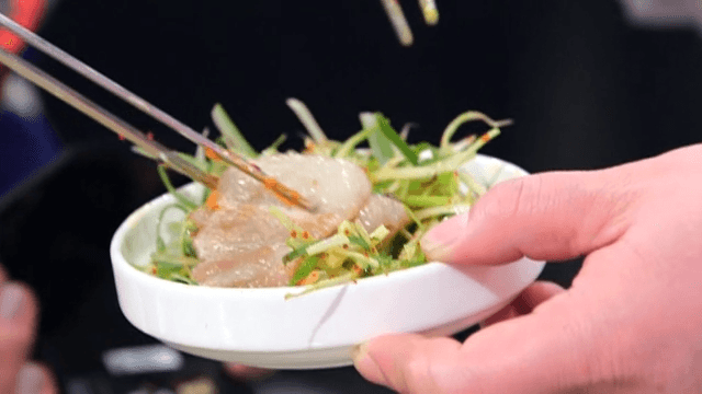 Picking up pork with Green Onion Salad