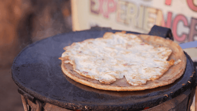 African flatbread baked on hot iron plate
