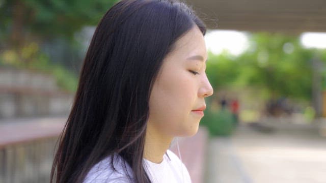 Woman enjoying a peaceful moment outdoors