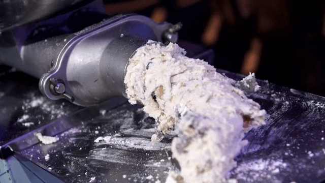 Dough being extruded in a machine