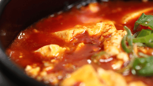 Spicy Mapo Tofu boiling in pot