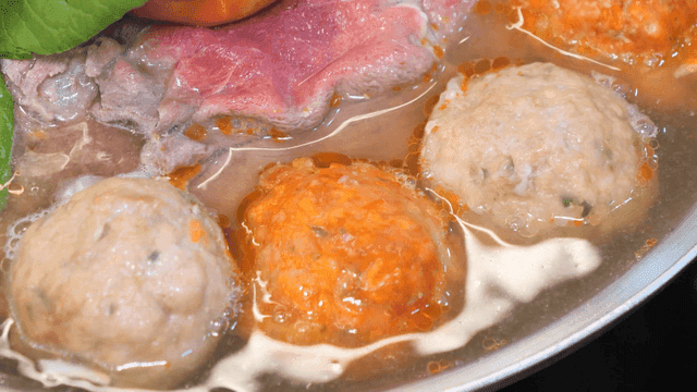 Rolled dumpling hot pot boiling in broth