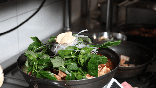 Gamjatang topped with fresh perilla leaves