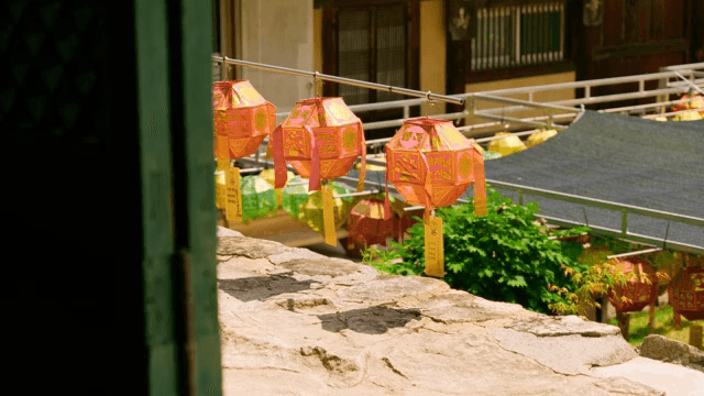 Colorful lanterns hanging in a temple courtyard