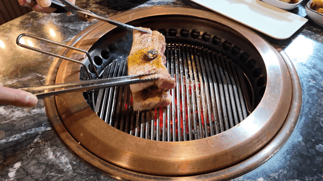 Pork belly grilled on Korean barbecue grill