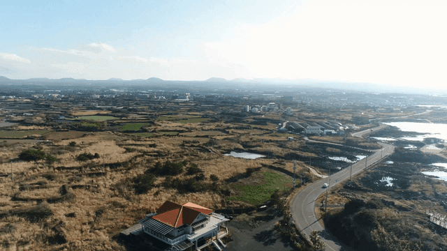 Coastal road with ocean and rocky shore
