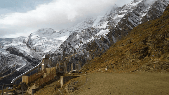 Snow-covered mountains with a slide