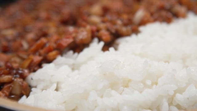 Appetizing black bean sauce with rice with minced meat and onions