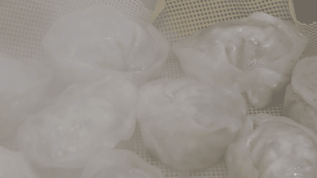 Smooth dumplings being steamed in steamer