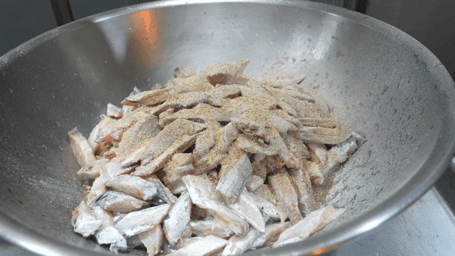 Scene of mixing fish and flour in bowl