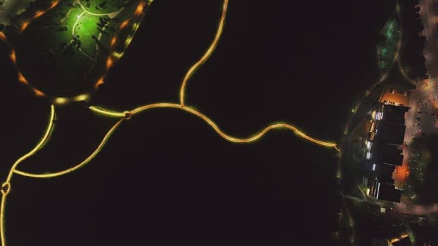 Illuminated pathways in a park at night