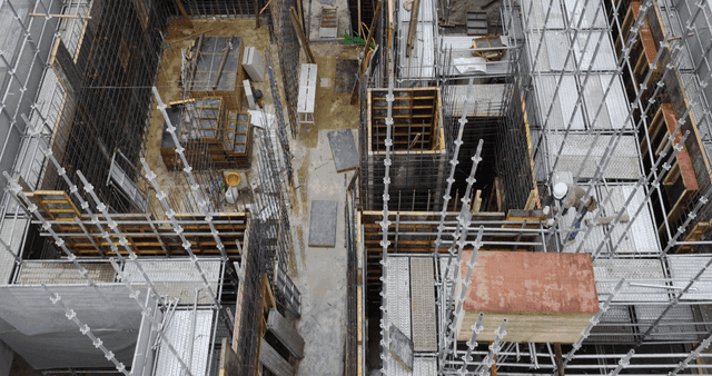 Construction site with scaffolding and materials