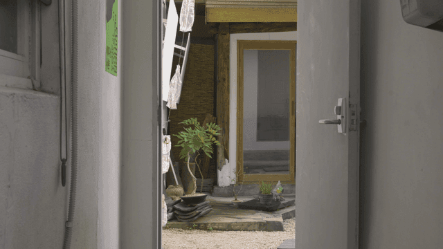 House yard with plastic bottle decorations hanging